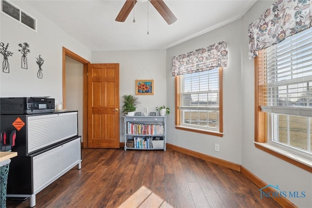 miscellaneous room featuring ceiling fan and dark hardwood / wood-style flooring