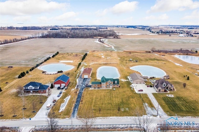 aerial view with a water view and a rural view