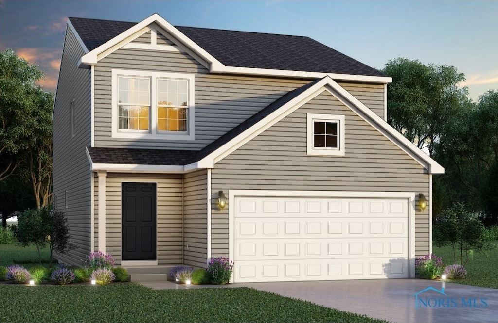 view of front of home with a garage