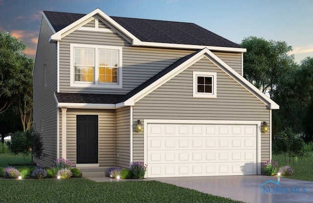 view of front of home with a garage
