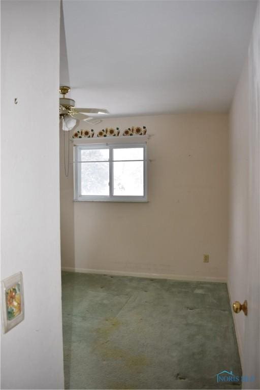 carpeted empty room with ceiling fan