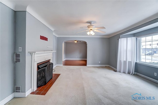 carpeted living room featuring ceiling fan