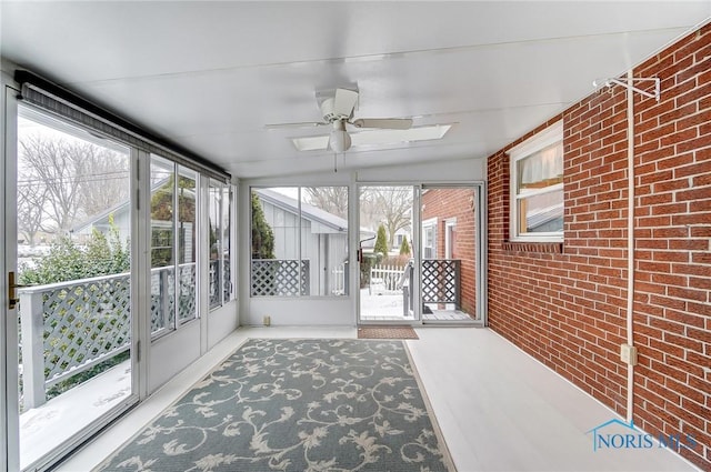 sunroom with ceiling fan and a wealth of natural light