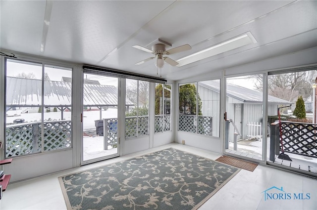 sunroom / solarium with ceiling fan and plenty of natural light