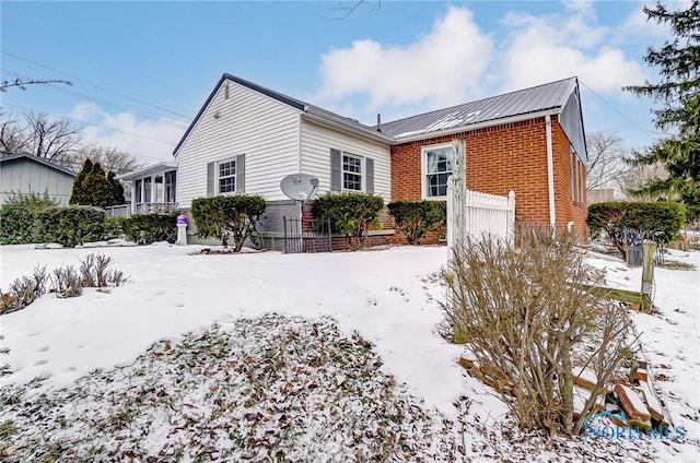 view of snow covered house