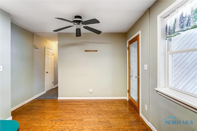 empty room featuring ceiling fan and light hardwood / wood-style floors