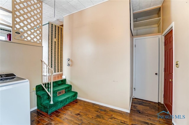 interior space featuring dark hardwood / wood-style floors and washer / dryer