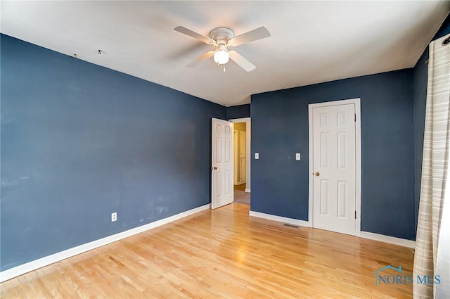 unfurnished bedroom with ceiling fan and light hardwood / wood-style flooring