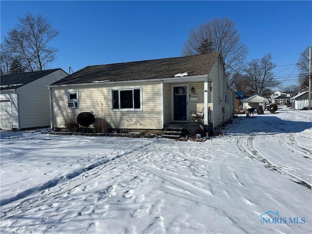 ranch-style house with cooling unit