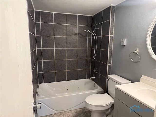 full bathroom with vanity, toilet, and tiled shower / bath