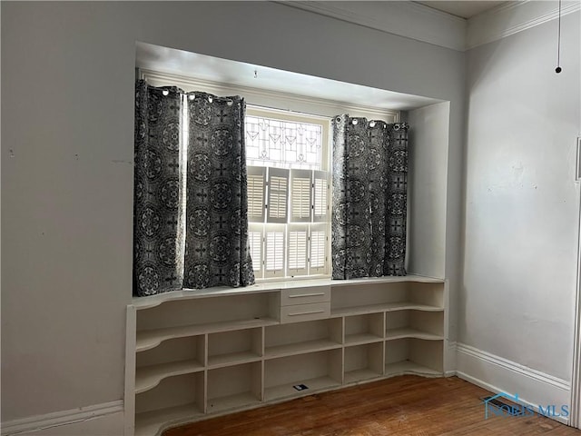 wine room with hardwood / wood-style flooring