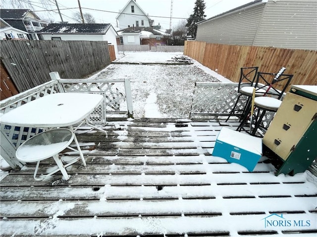 view of snow covered deck