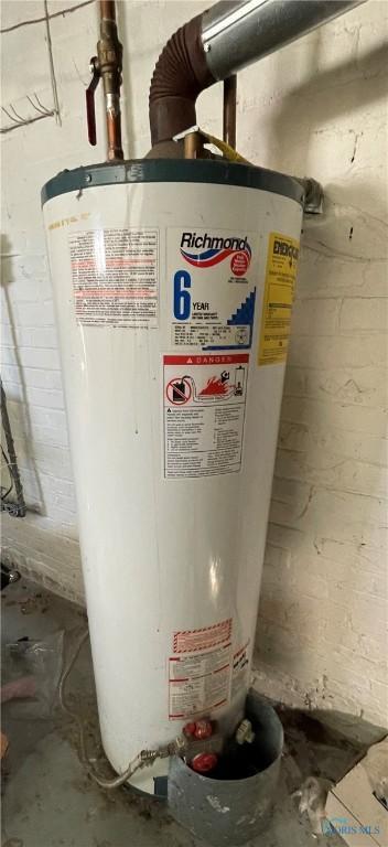 utility room with water heater