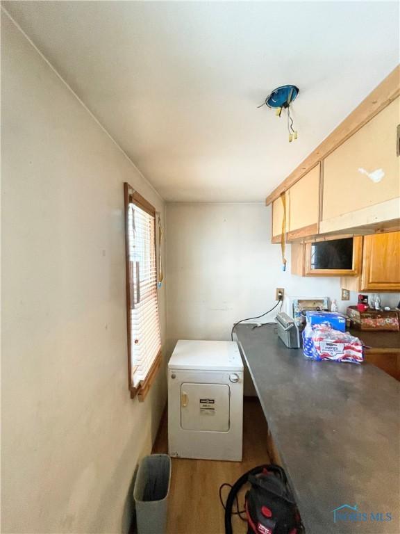 interior space with fridge and light hardwood / wood-style floors