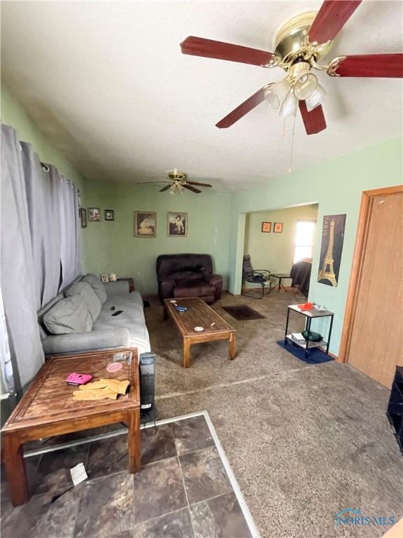 living room featuring ceiling fan