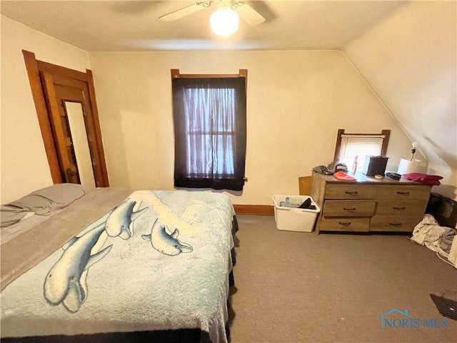 bedroom featuring lofted ceiling, carpet flooring, and ceiling fan