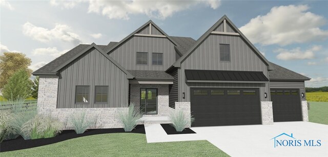 view of front facade with a garage and a front yard