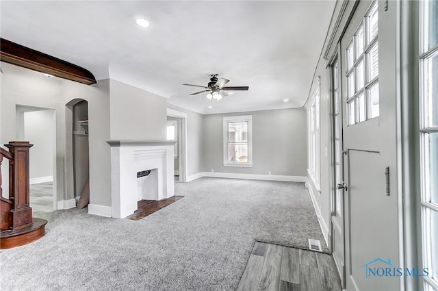 living room featuring light carpet and ceiling fan