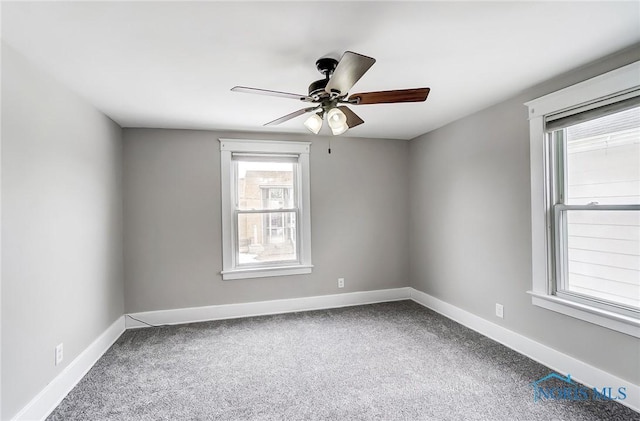 carpeted empty room with ceiling fan