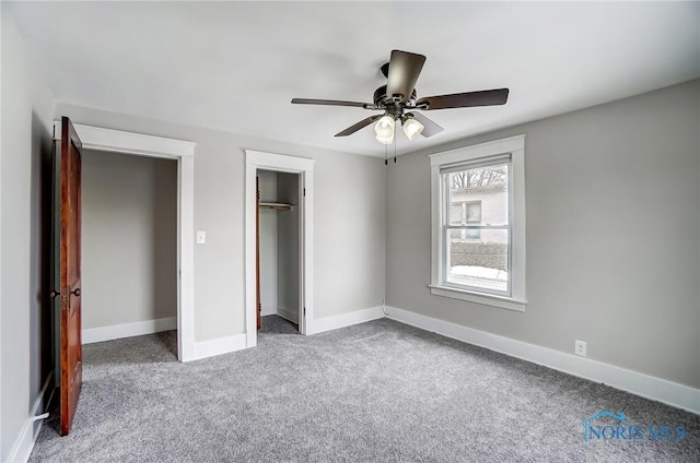 unfurnished bedroom featuring ceiling fan and carpet flooring