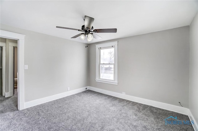 empty room with ceiling fan and carpet