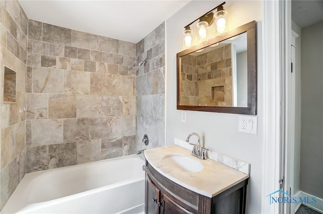 bathroom with vanity and tiled shower / bath combo