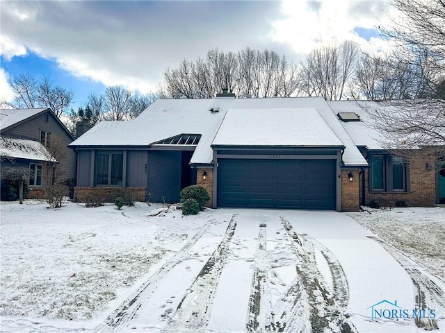 single story home featuring a garage