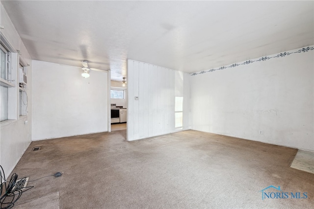 unfurnished room with carpet flooring