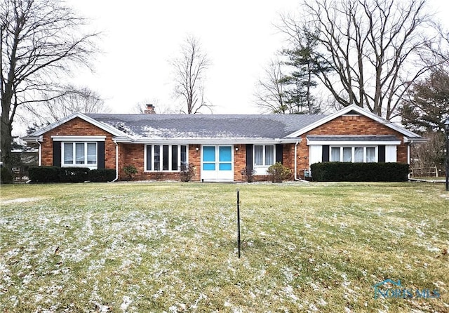 ranch-style home featuring a front yard