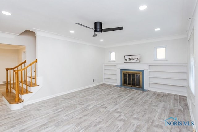 unfurnished living room with crown molding, ceiling fan, and light hardwood / wood-style flooring