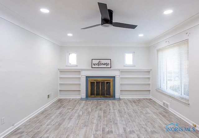 unfurnished living room with ceiling fan and light hardwood / wood-style flooring