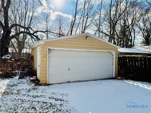 view of snow covered garage