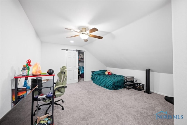 bedroom featuring vaulted ceiling, light colored carpet, and ceiling fan