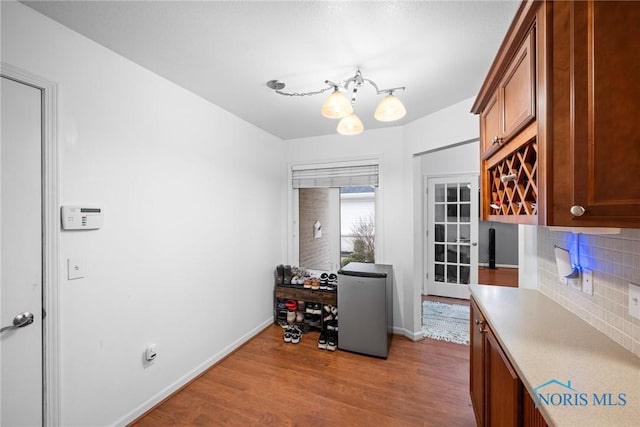 office area featuring light hardwood / wood-style flooring and a notable chandelier