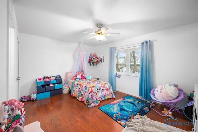 bedroom featuring ceiling fan and wood-type flooring