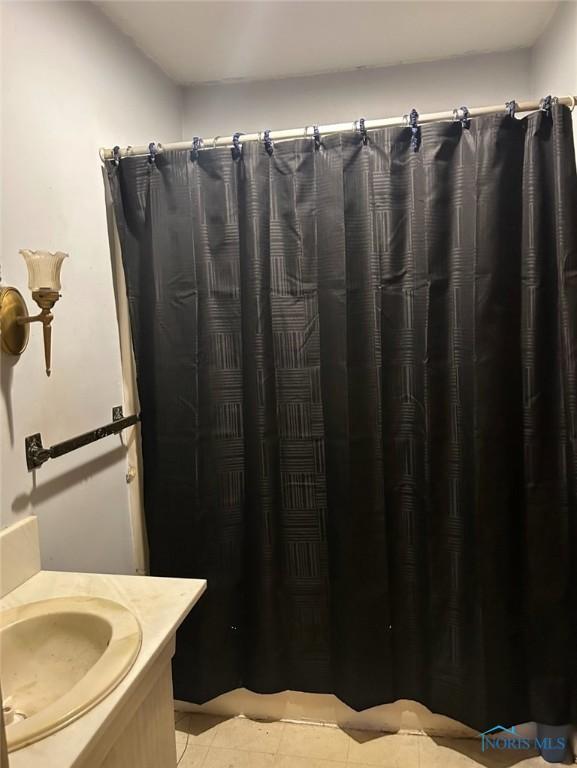 bathroom with vanity, tile patterned floors, and a shower with shower curtain