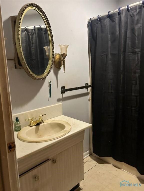 bathroom featuring vanity and tile patterned flooring