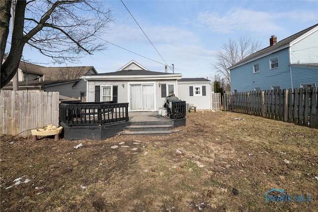 rear view of house with a deck