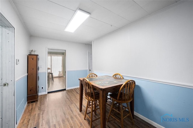 dining area with hardwood / wood-style floors