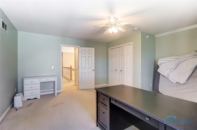 carpeted home office with ceiling fan