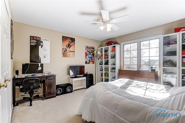 bedroom with light colored carpet and ceiling fan