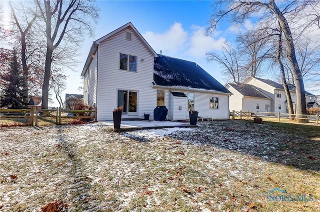 back of property featuring a patio