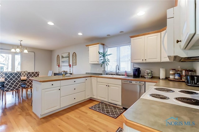 kitchen featuring sink, light hardwood / wood-style flooring, kitchen peninsula, dishwasher, and pendant lighting