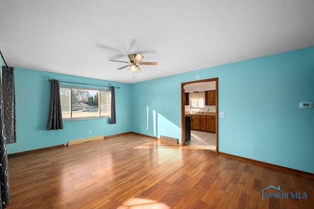 unfurnished bedroom featuring ceiling fan and light wood-type flooring