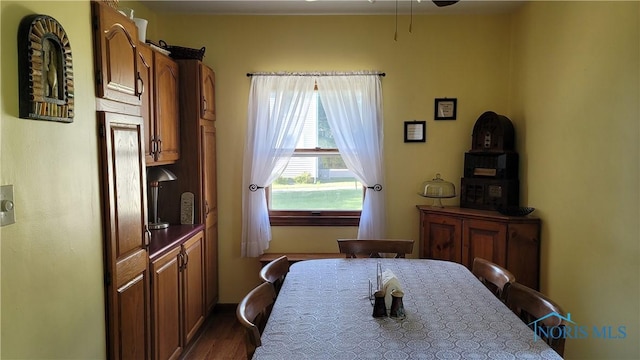 dining room with dark hardwood / wood-style floors