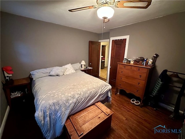 bedroom featuring ceiling fan and dark hardwood / wood-style floors