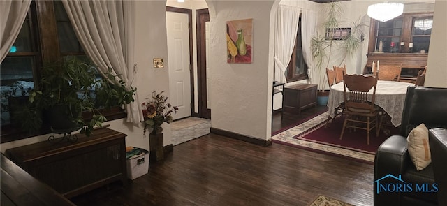 interior space with a fireplace and dark hardwood / wood-style flooring