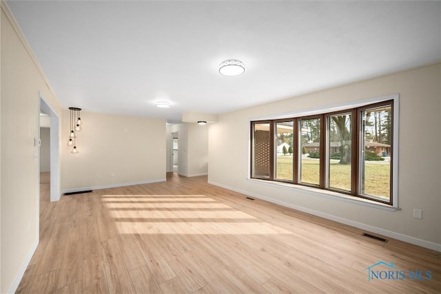 unfurnished living room featuring light wood-type flooring