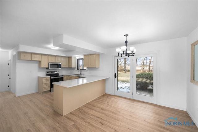 kitchen with sink, hanging light fixtures, stainless steel appliances, light brown cabinetry, and kitchen peninsula