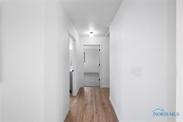 hallway featuring light wood-type flooring